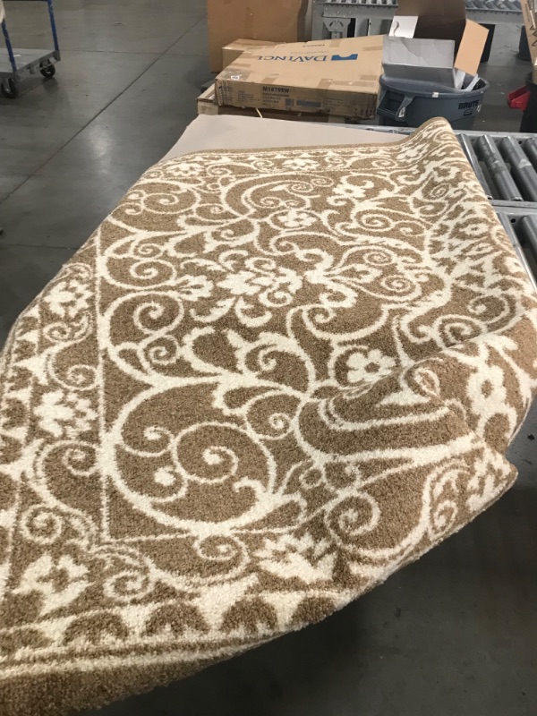 Photo 1 of 4'6'' x 7'1' brown white pattern areea rug