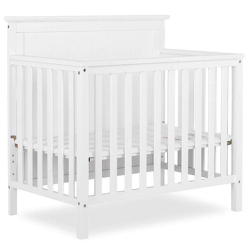 Photo 1 of Dream On Me Ava 4-in-1 Convertible Mini Crib in White, Greenguard Gold Certified, Non-Toxic Finish, Comes with 1" Mattress Pad, with 3 Mattress Height Settings
