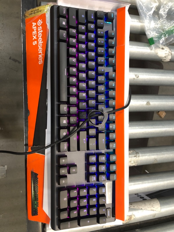 Photo 1 of SteelSeries Apex 5 Hybrid Mechanical Gaming Keyboard – Per-Key RGB Illumination – Aircraft Grade Aluminum Alloy Frame – OLED Smart Display (Hybrid Blue Switch) Hybrid Blue – Tactile & Clicky Apex 5