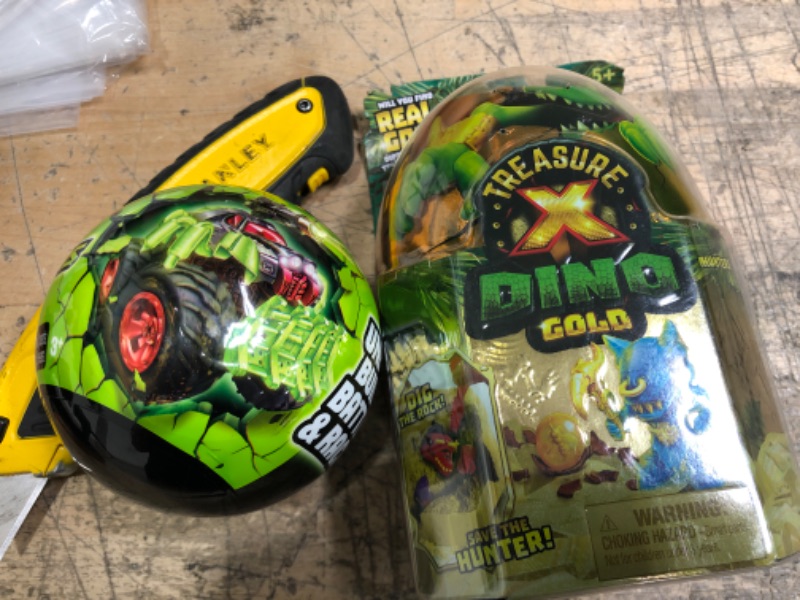 Photo 1 of **BUNDLE OF 2**
--5 SURPRISE Monster Trucks Glow Riders Series 2 Mystery Collectible Capsule by ZURU
--Treasure X Dino Gold Action Figure