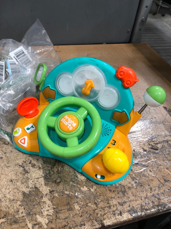 Photo 2 of Bright Starts Lights and Colors Driver Toy Steering Wheel with Car Sounds for Pretend Play - Green, 6 Months and up
