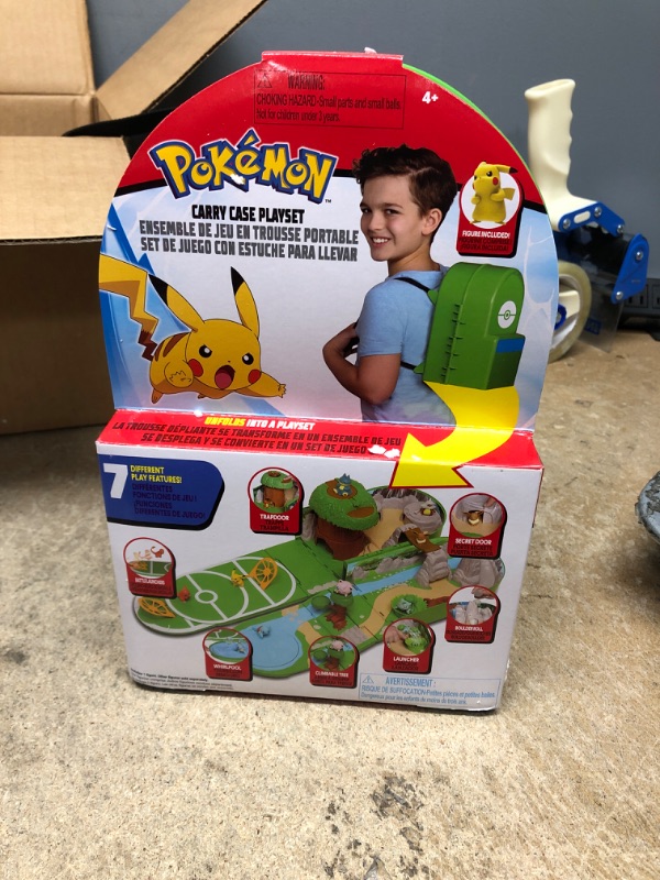 Photo 2 of Pokemon Carry Case Playset, Feat. Different Locations Within One Playset, with 2-Inch Pikachu Figure, Treetop Trap Door, Battle Area, Hidden Cave and More - Easily Folds into a Backpack