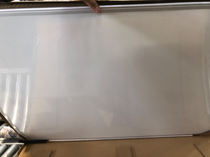 Photo 2 of DAMAGED Amazon Basics Magnetic Dry Erase White Board, 35 x 47-Inch Whiteboard - Silver Aluminum Frame 35" x 47" Magnetic, Aluminum Frame 
**BENT CORNER**