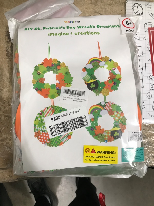 Photo 1 of 12 Sets St. Patrick's Day Shamrock Wreath Sign Decorations Foam St. Patrick's Day Craft Kits Lucky Shamrock Four-Leaf Clover Rainbow Foam Stickers for Kids Party Favors Classroom Activity Art Project