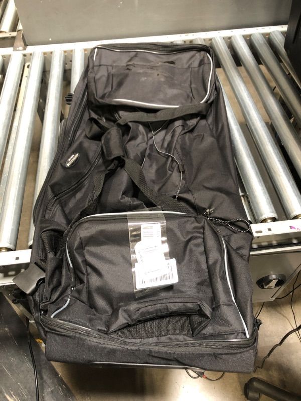Photo 2 of **SMALL TEARS** Travelers Club 36" 2 Section Drop Bottom Rolling Duffel Black bottom is a little torn