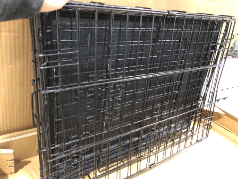 Photo 7 of **used-rusty**
24' inch Amazon Basics Foldable Metal Wire Dog Crate with Tray, Single or Double Door Styles-24"L x 18"W x 20"H

