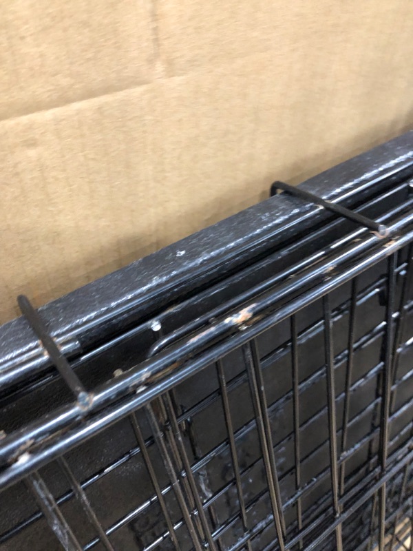 Photo 4 of **used-rusty**
24' inch Amazon Basics Foldable Metal Wire Dog Crate with Tray, Single or Double Door Styles-24"L x 18"W x 20"H

