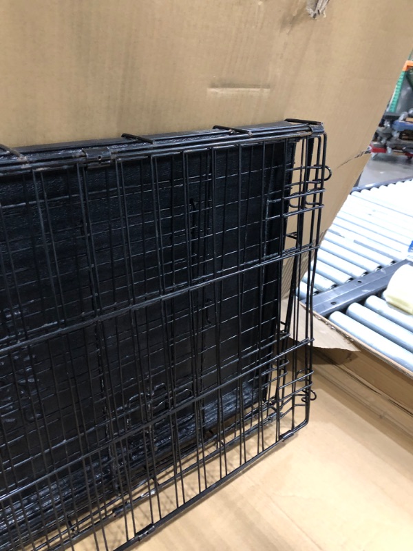 Photo 5 of **used-rusty**
24' inch Amazon Basics Foldable Metal Wire Dog Crate with Tray, Single or Double Door Styles-24"L x 18"W x 20"H

