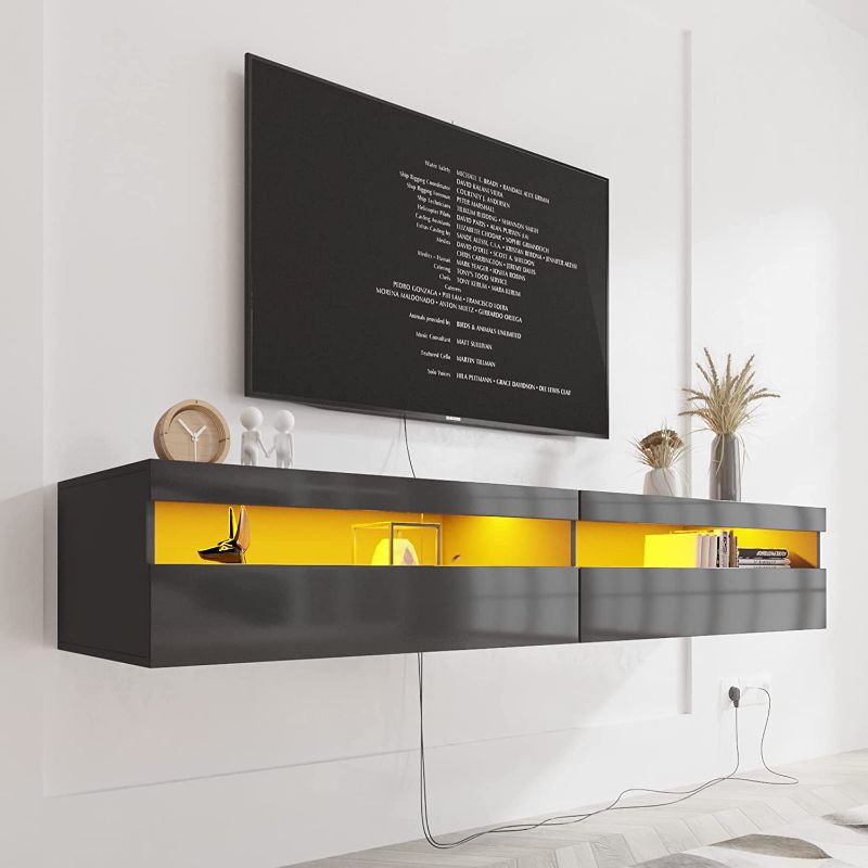 Photo 1 of **READ COMMENTS**
Floating TV Stand with Led Lights, 70" Floating Entertainment Center Up to 80 Inch TVS, Led TV Stand Wall Mounted, High Gloss, 29 Scene Modes, Millions Changing Lights Black
