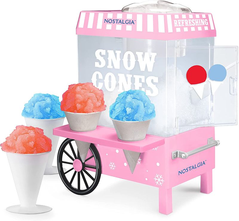 Photo 1 of POWER TESTED
Nostalgia Vintage Countertop Snow Cone Maker Makes 20 ICY Treats, Includes 2 Reusable Plastic Cups & Ice Scoop, Pink
