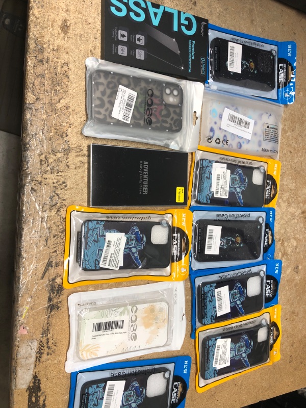 Photo 1 of MISCELLANEOUS BUNDLE OF ASSORTED PHONE CASES AND OTHER ELECTRONICAL GOODS