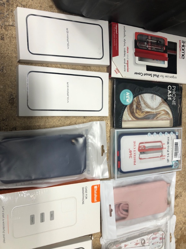 Photo 1 of MISCELLANEOUS BUNDLE OF ASSORTED PHONES CASES AND OTHER ELECTRONICAL GOODS