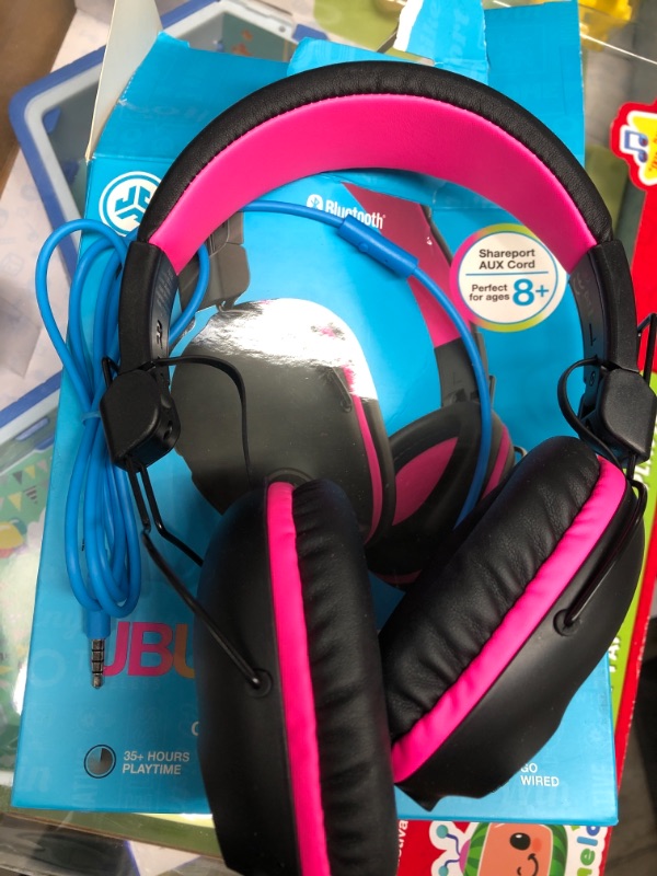 Photo 2 of JLab JBuddies Pro Wireless Over-Ear Kids Headphones | 35+ Hour Battery Life | Built-in Volume Regulators for Safety | Share Mode | Folding | Adjustable | Noise Isolation | with Mic | Pink