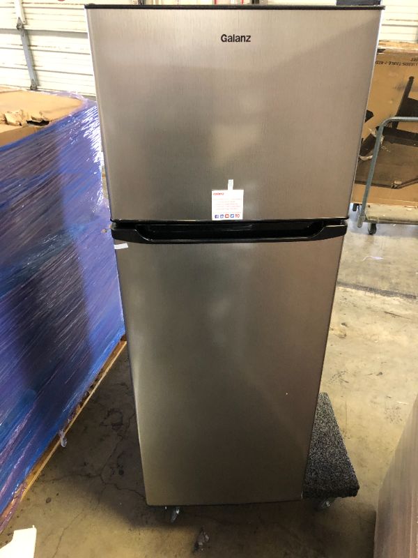 Photo 2 of Galanz GLR12TS5F Refrigerator, Dual Door Fridge, ** TOP CORNER DENTED, STENCH FROM INSIDE. Adjustable Electrical Thermostat Control with Top Mount Freezer Compartment, 12.0 Cu.Ft, Stainless Steel
