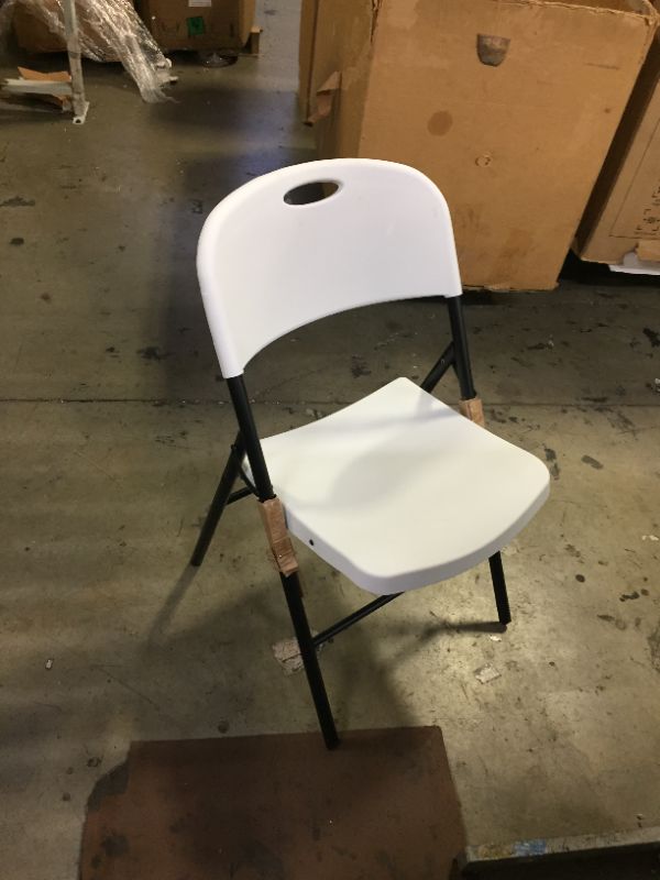 Photo 1 of Amazon Basics Folding Plastic Chair with 350-Pound Capacity -  White   -------cleaning needed ----------