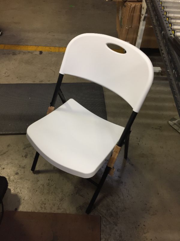 Photo 1 of Amazon Basics Folding Plastic Chair with 350-Pound Capacity -  White   -------cleaning needed ----------