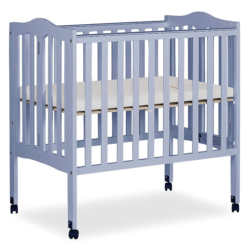 Photo 1 of Dream On Me 2-in-1 Lightweight Folding Portable Crib in Dusty Blue, Greenguard Gold Certified -------THERE ARE A FEW DAMAGE SPOTS VIEW PICTURES FOR REFERENCE ----
