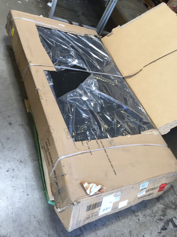 Photo 1 of Classic Brands Adjustable Comfort Upholstered Adjustable Bed Base with Massage, Wireless Remote, Three Leg Heights, and USB Ports-Ergonomic, King, Black-------THERE IS A RIP ON THE BED SEE PICTURES FOR REFERENCE ---BESIDE THE RIP EVERYTHING IS NEW AND GOO