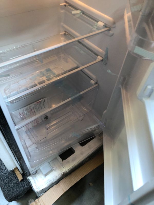 Photo 8 of RCA RFR741-BLACK Apartment Size-Top Freezer-2 Door Fridge-Adjustable Thermostat Control-Black-7.5 Cubic Feet
------THERE ARE BIG DENT AND CRACKS ON THE INSIDE SHLVES ----VIEW PICTURES FOR REFERENCE 