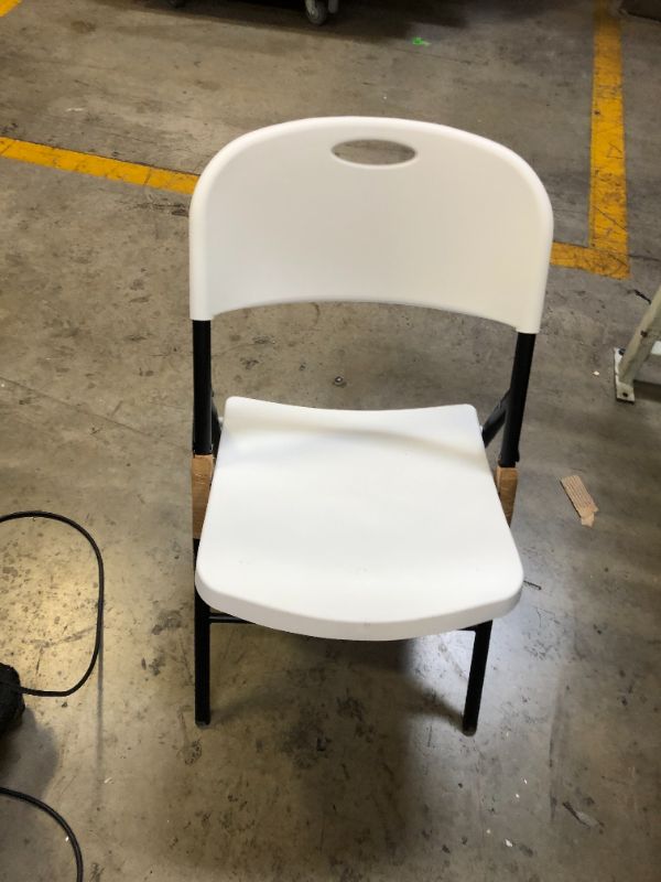 Photo 2 of Amazon Basics Folding Plastic Chair with 350-Pound Capacity -1