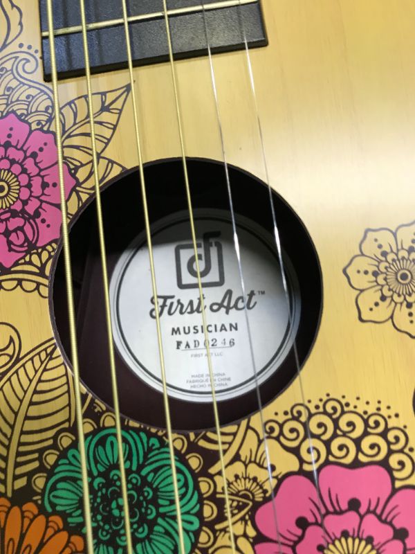 Photo 1 of First Act Acoustic Guitar, 30 Inch - Top Features Flower Design - Brass Acoustic Guitar Strings, Tuning Gear, String Post Covers, Steel-Reinforced Neck, Strap Buttons – Musical Instruments
