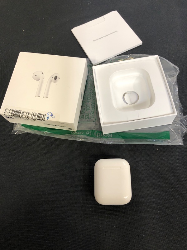 Photo 2 of Apple AirPods (2nd Generation) Wireless Earbuds with Lightning Charging Case Included. Over 24 Hours of Battery Life, Effortless Setup. Bluetooth Headphones for iPhone
