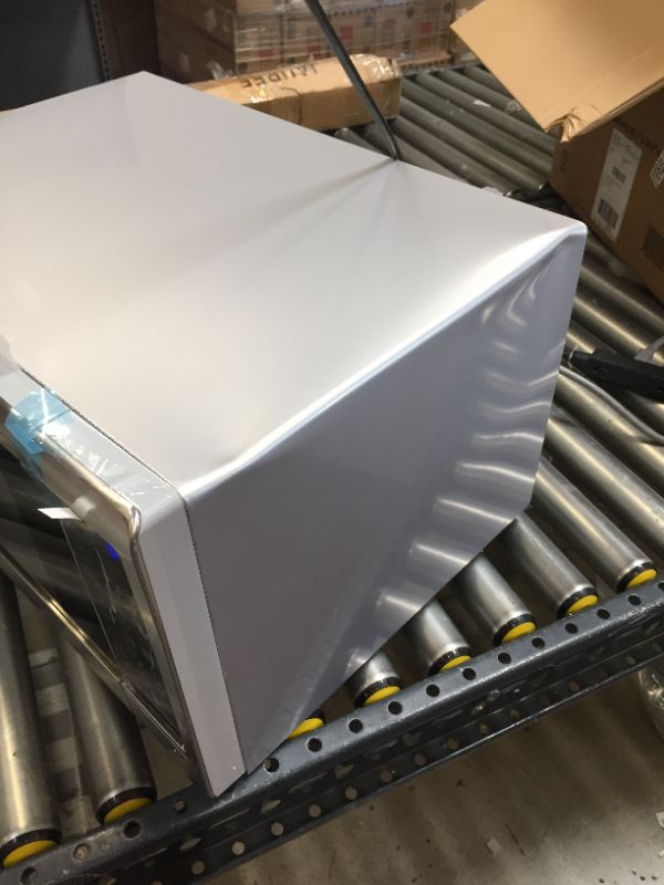 Photo 6 of Sharp SMC1842CS 24" Countertop Microwave with 1.8 cu. ft. Capacity, 1100 Watts, 15" Turntable, Softening Function Blue LED Display, in Stainless Steel-------there is a lot of minor dents ---------------THE DAMAGE HAPPENED IN SHIPPING PROCESS ---------
