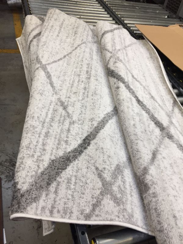 Photo 1 of 5'x8' area rug -----cleaning needed ---------