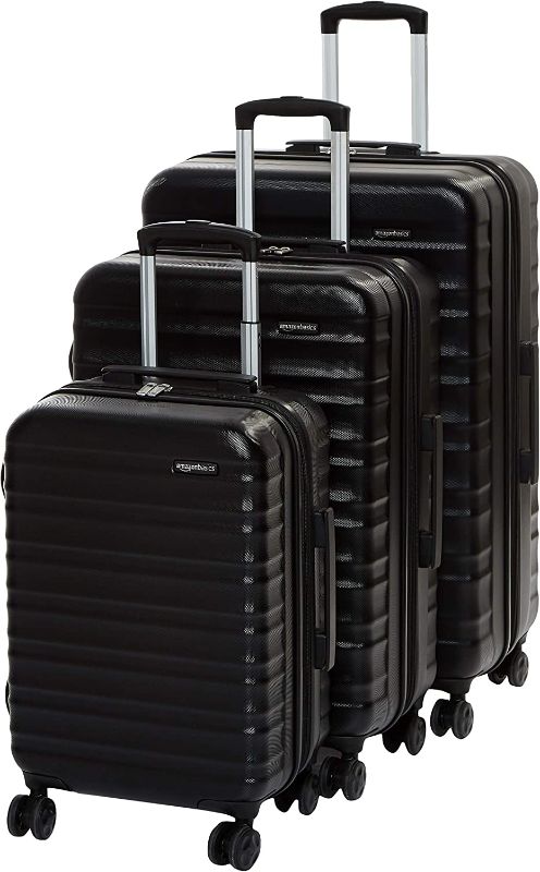 Photo 1 of Amazon Basics 3-Piece Set Hardside Spinner, Black, MINOR MARKINGS, BENT HANDLE ON LARGEST LUGGAGE THAT DOES NOT OPEN/CLOSE. (STUCK IN PLACE)  
