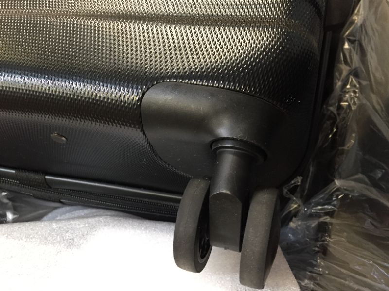 Photo 5 of Amazon Basics 3-Piece Set Hardside Spinner, Black, MINOR MARKINGS, BENT HANDLE ON LARGEST LUGGAGE THAT DOES NOT OPEN/CLOSE. (STUCK IN PLACE)  
