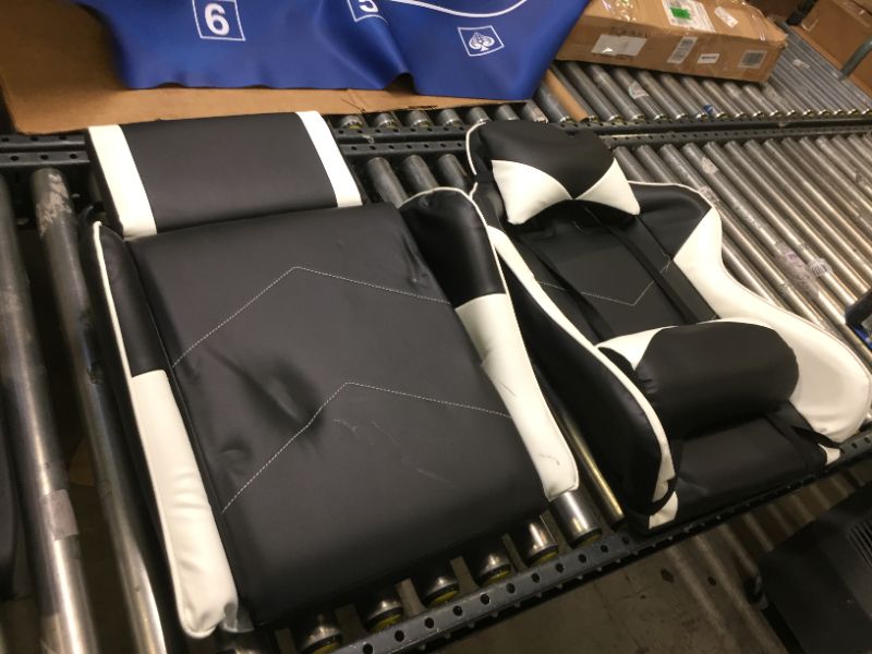 Photo 1 of white and black gaming chair 