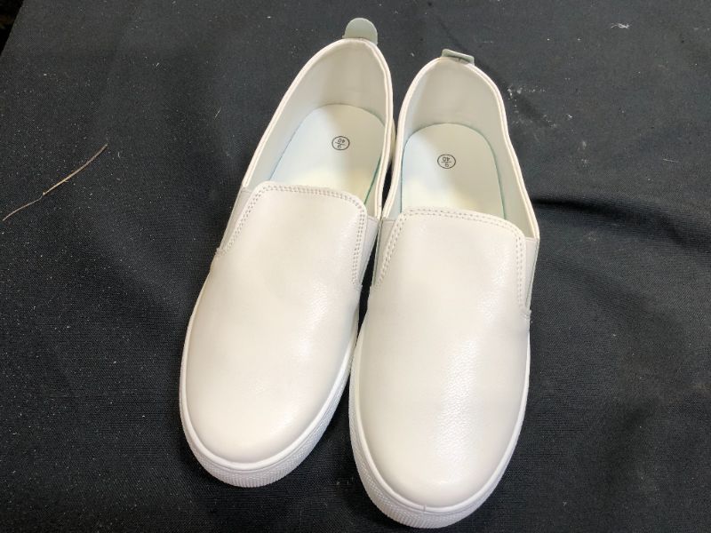 Photo 1 of generic white slip on shoes size 9