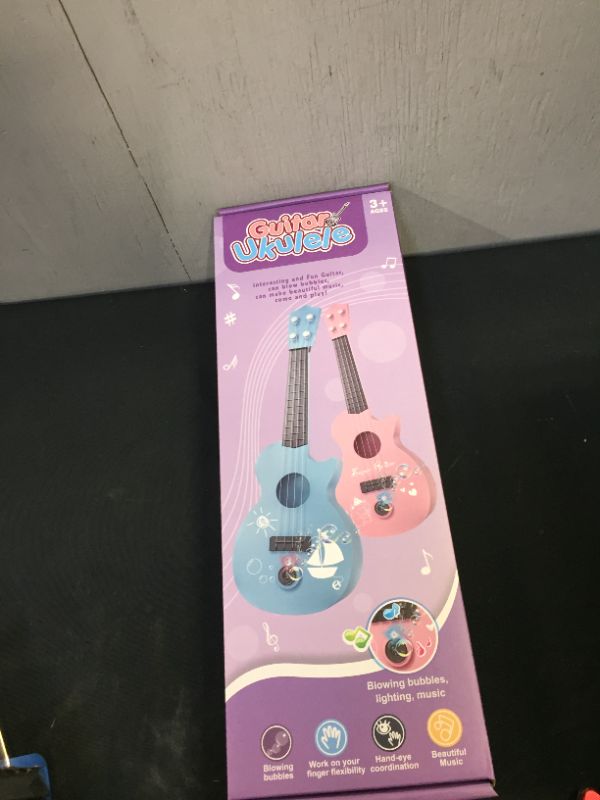 Photo 1 of Bubble Machine for Kids, Automatic Bubble Maker with Musical, Guitar Bubble Blower Toys for Toddlers 1-3, Party, Outdoor Activity, Birthday Gift, Pink
