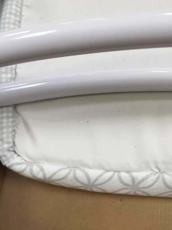 Photo 2 of Delta Children Newborn Soothing Sleeper Bassinet - Portable Baby Crib with Compact Fold, Grey Infinity. Box packaging Damaged, Minor Use, Found Hair on Item.