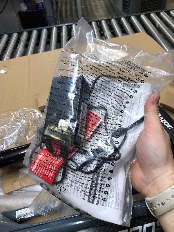 Photo 6 of Razor E300 Electric Scooter. Box Packaging Damaged, Minor Scratches and Scuffs on Metal, Turns on and Runs.  Missing Hardware For Seat