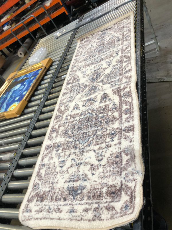 Photo 1 of 2x6ft Rug. Moderate Use, Tape on Item. 