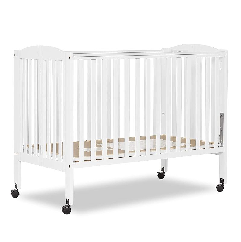 Photo 1 of Dream On Me, Full Size 2-in-1 Folding Stationary Side Crib, White. Box Packaging Damaged. Missing Hardware, Scratches and Scuffs on item.
