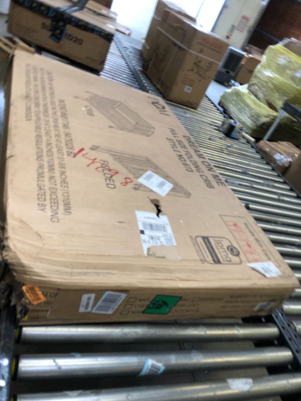 Photo 1 of Dream On Me, Full Size 2-in-1 Folding Stationary Side Crib, White. Box Packaging Damaged. Missing Hardware, Scratches and Scuffs on item.
