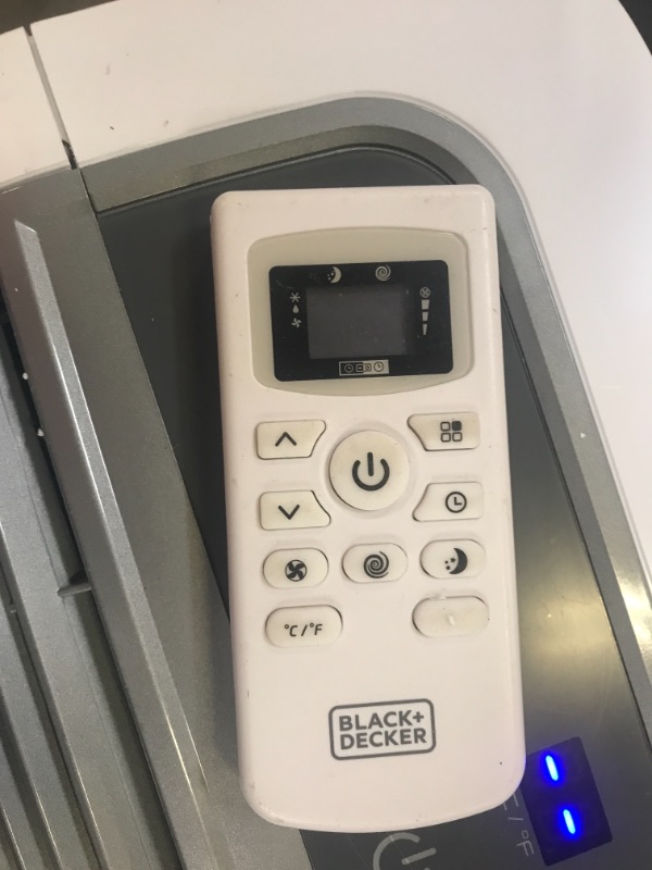 Photo 5 of BLACK+DECKER 8,000 BTU Portable Air Conditioner with Remote Control, White. Remote did not turn on. Back piece could not go back in.
