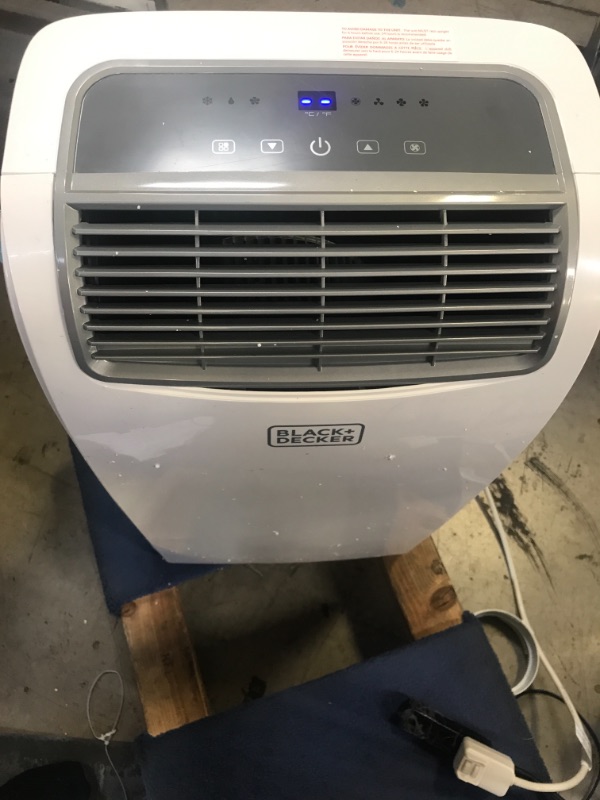 Photo 1 of BLACK+DECKER 8,000 BTU Portable Air Conditioner with Remote Control, White. Remote did not turn on. Back piece could not go back in.

