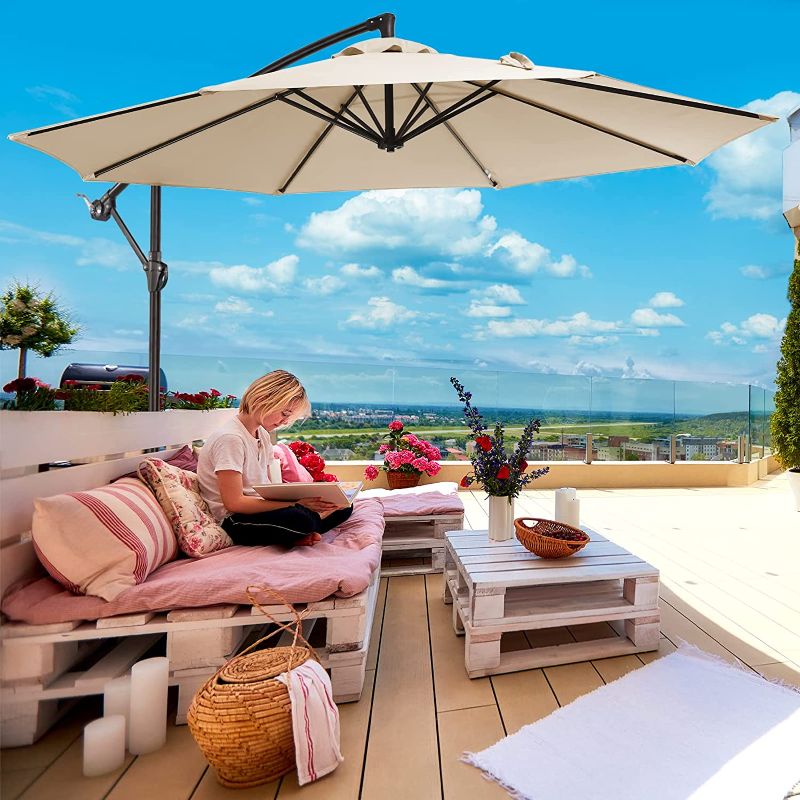 Photo 2 of MCADORE 10' Patio Offset Hanging Umbrella, Outdoor Market Cantilever Umbrella Polyester Material Shade UV Protection for Backyard, Garden, Lawn and Poolside w/8 Ribs & Easy Tilt Adjustment (Beige). Box Packaging Damaged, Moderate Use, Minor Scuffs and SCr