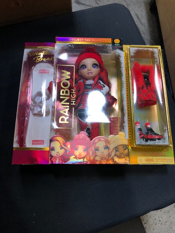 Photo 2 of Rainbow High Winter Break Ruby Anderson – Red Fashion Doll and Playset with 2 Designer Outfits, Snowboard and Accessories
