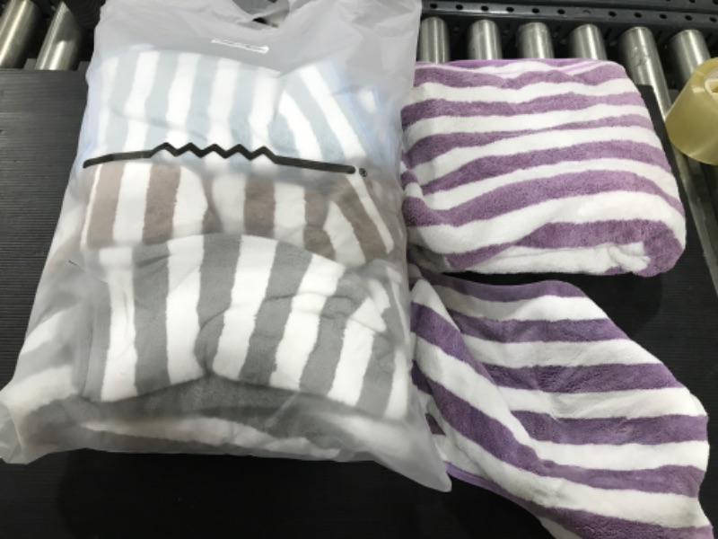 Photo 1 of  4 towels and 4 small washcloths different colors 