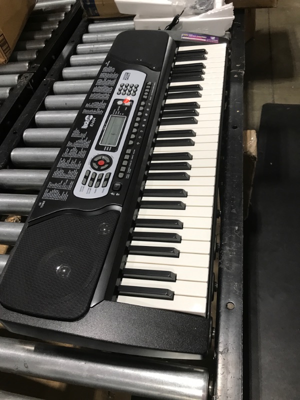 Photo 2 of RockJam 54-Key Portable Electronic Keyboard with Interactive LCD Screen & Includes Piano Maestro Teaching App with 30 Songs & Adjustable Keyboard Stand with Locking Straps & Quick Release Mechanism