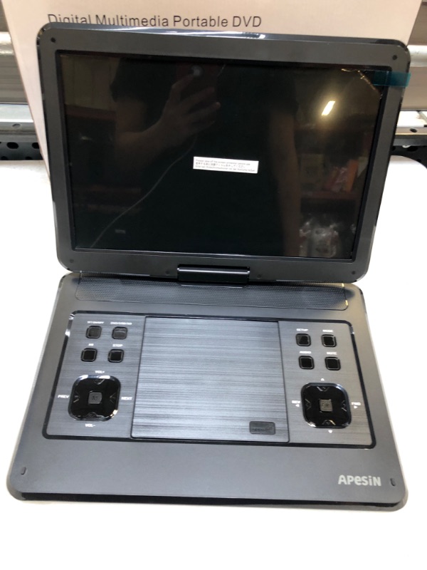 Photo 2 of APESIN Portable DVD Player, 14.1 inch Swivel Screen, SD Card Slot and USB Port - Black CHARGE BEFORE USAGE 
