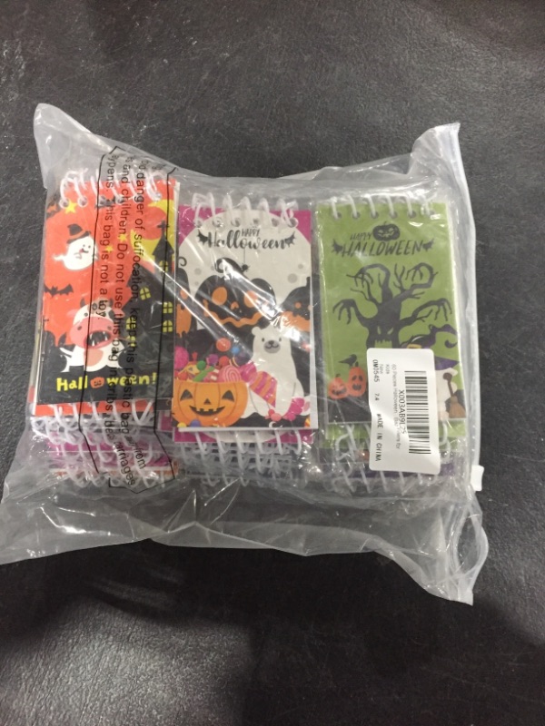 Photo 1 of 60 Pieces Halloween Mini Spiral Notepads Party Favors for Kids, Hallowmas Mini Pumpkin Notebooks, Halloween Gifts Party Favors Goody Bag Fillers for Kids