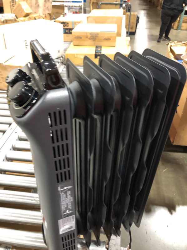 Photo 3 of Amazon Basics Portable Radiator Heater with 7 Wavy Fins, Manual Control, Black, 1500W
