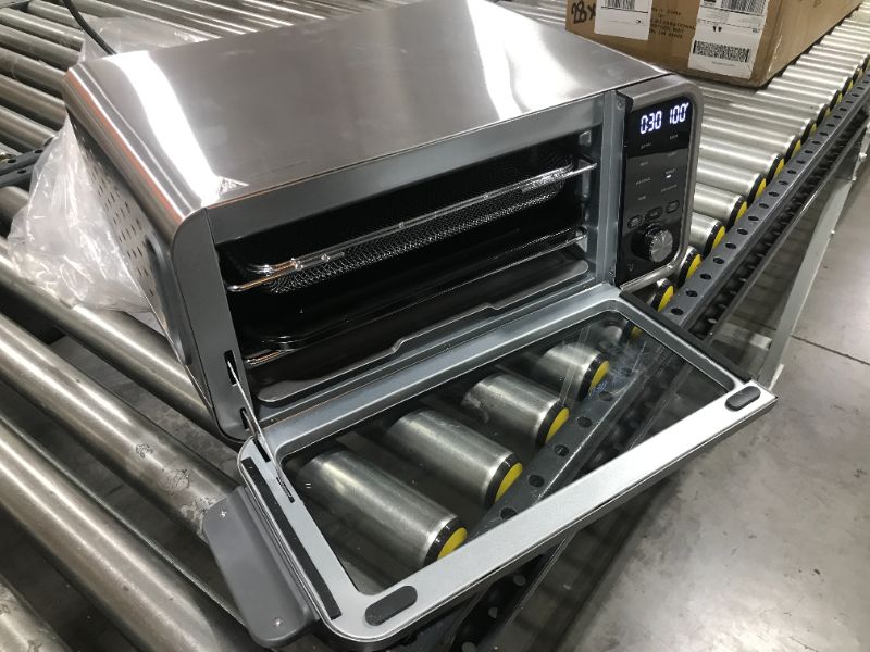 Photo 3 of Ninja SP101 Digital Air Fry Countertop Oven with 8-in-1 Functionality, Flip Up & Away Capability for Storage Space, with Air Fry Basket, Wire Rack & Crumb Tray, Silver
