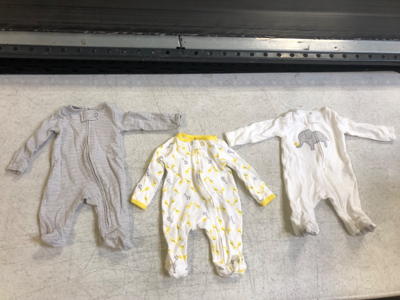 Photo 2 of SIZE 0 -- Simple Joys by Carter's Unisex Babies' Cotton Footed Sleep and Play, Pack of 3 0-3 Months Elephant/Stripe/Giraffe