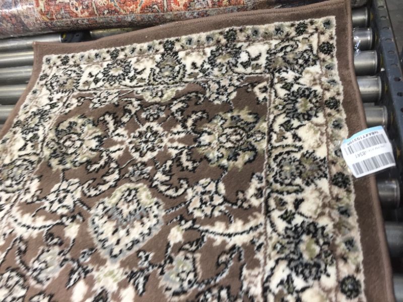 Photo 3 of 31"x95" Brown Runner Rug, No Box Packaging, Moderate Use, Creases and Wrinkles in item. Minor Fraying on Edges, Hair Found on item, Dirty From Shipping and Handling, Tape found on Item
